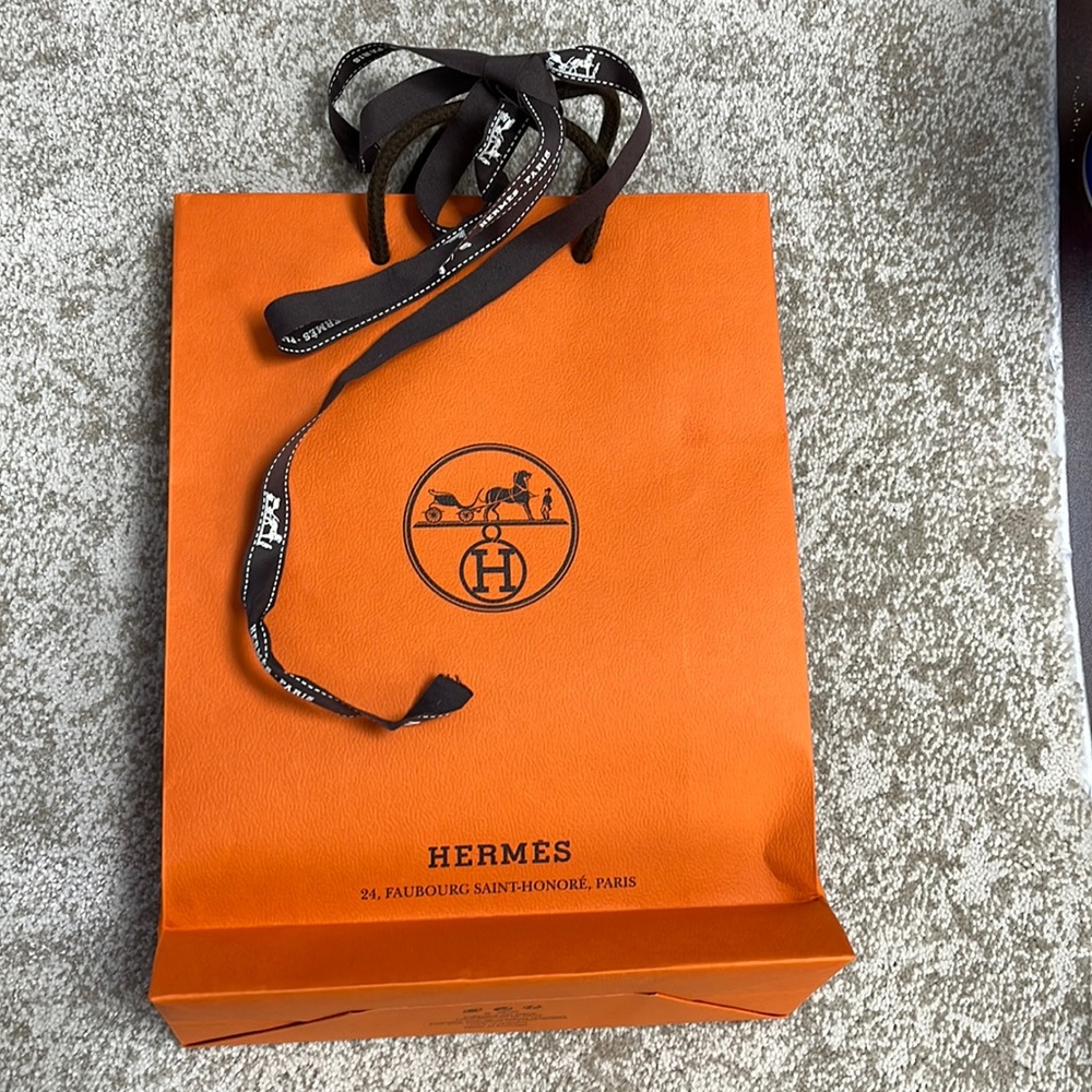 Hermes paper  shopping bag. New small bag with ribbon. Original from Hermes.